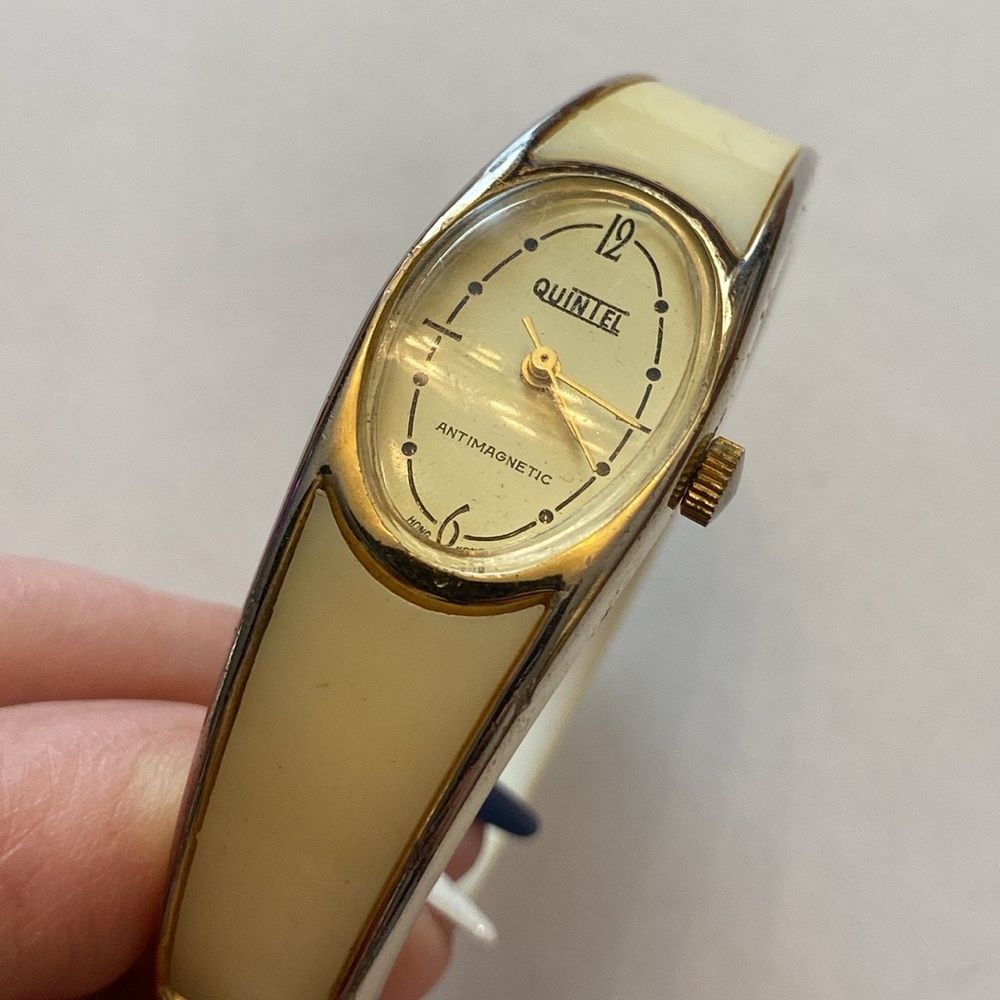 Vtg. QUINTEL cream wind-up bangle watch